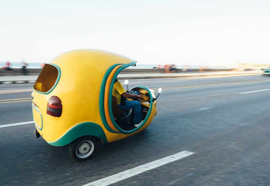 Coco-taxi on Havana's Malecon